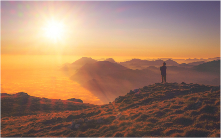 man on top of mountain